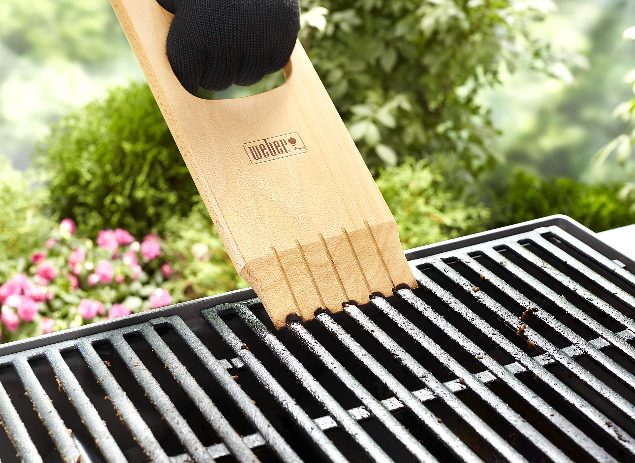 Weber wood scraper handle detail highlighting ergonomic grip for control