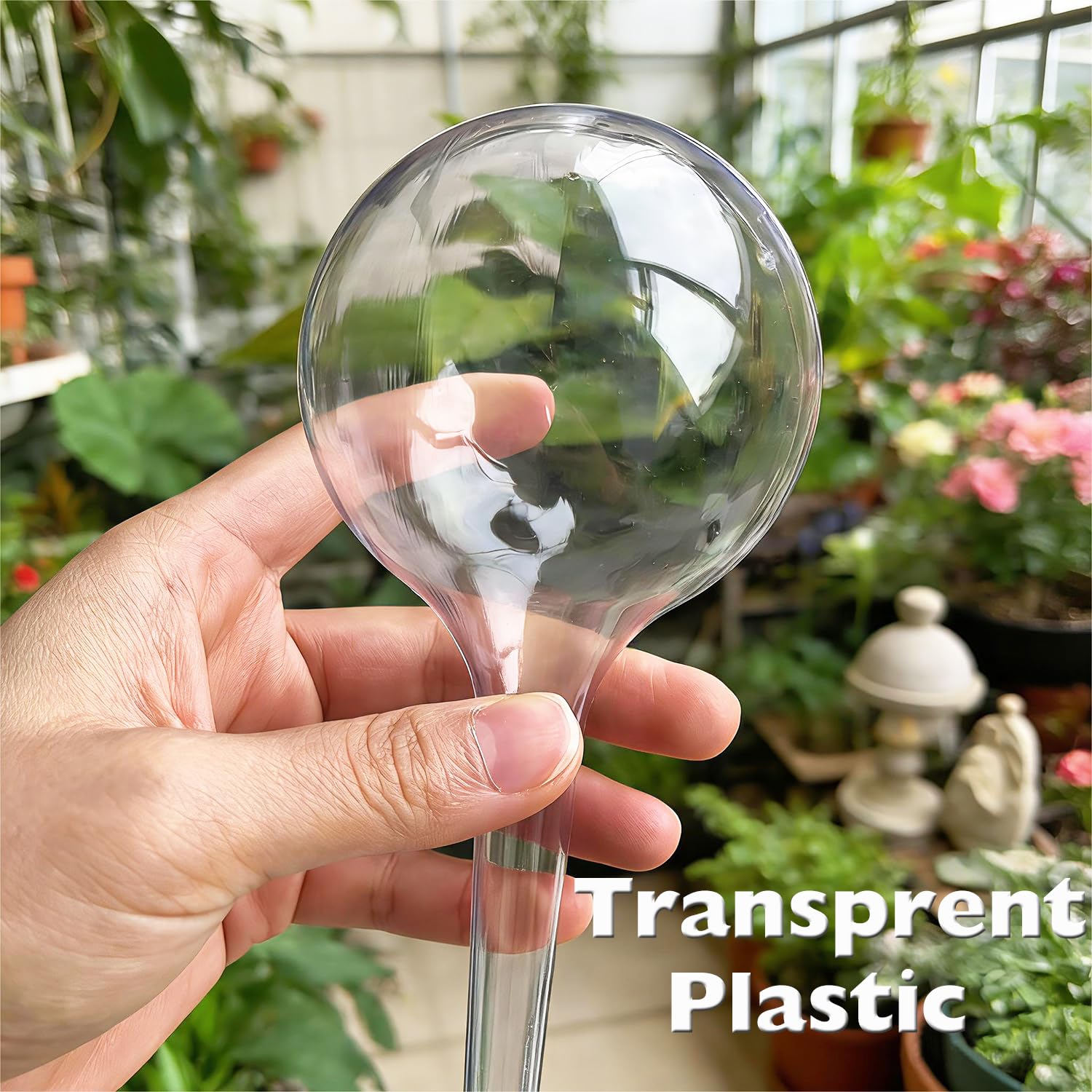 Wellinc globe inserted in a large pot keeping soil evenly moist