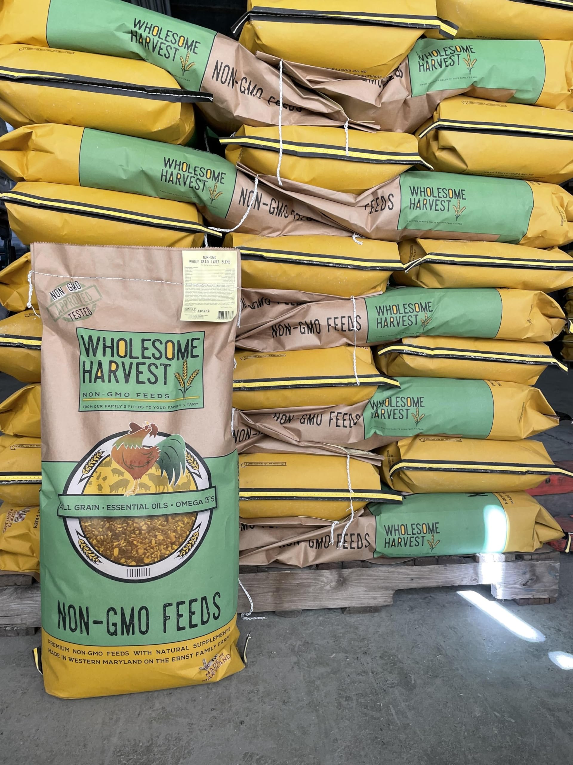 Wholesome Harvest 10 lb bag beside a hand to show scale and convenient size