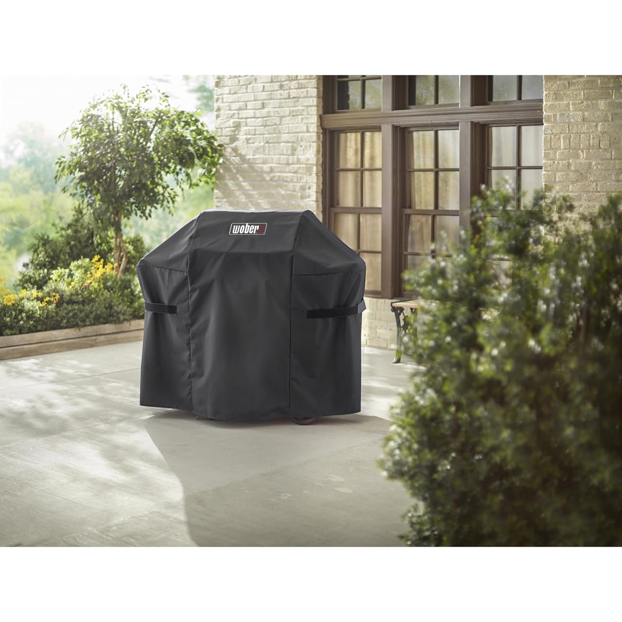 WOBER COVER on grill in backyard setting protects from weather and dust