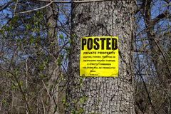 WristCo sign stapled to tree demonstrating easy-installation benefit