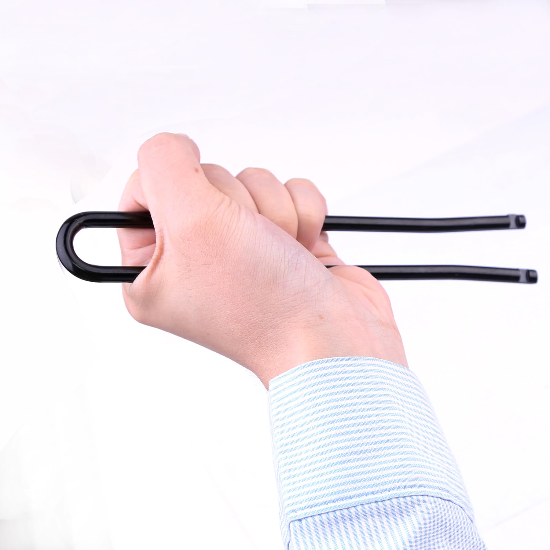 Ypzxola setter in use compressing a body-grip trap for safer installation
